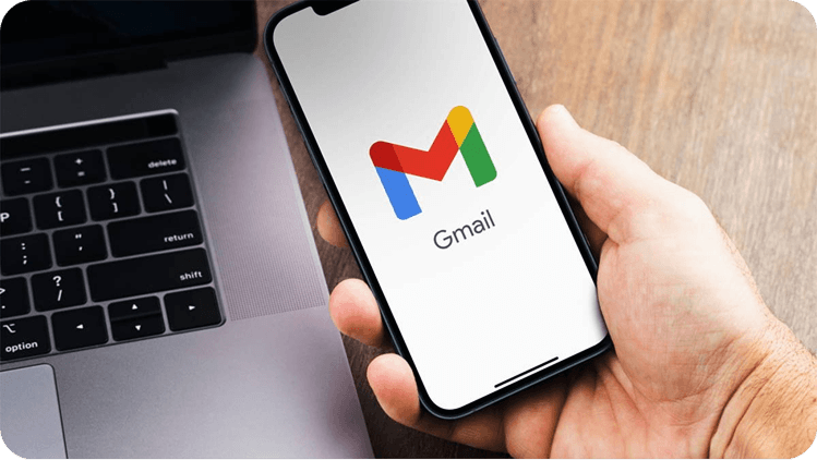 Hand holding phone with Gmail open